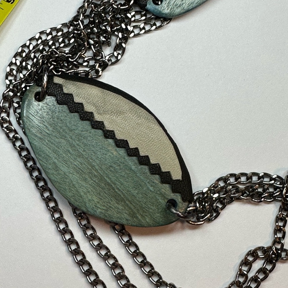 Western style layered silver necklace with blue and tan ovals